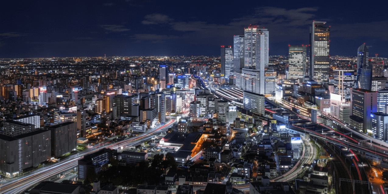 Nagoya Castle stone walls and gilded roof ornaments against the city skyline
