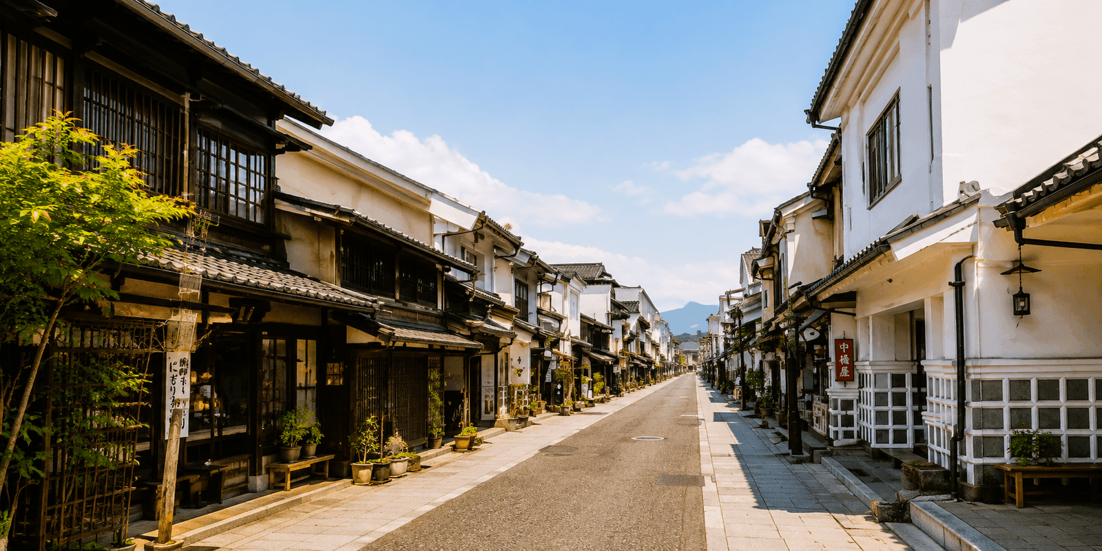 Namako-kabe black-and-white storehouse walls lining Nakamachi Street in Matsumoto