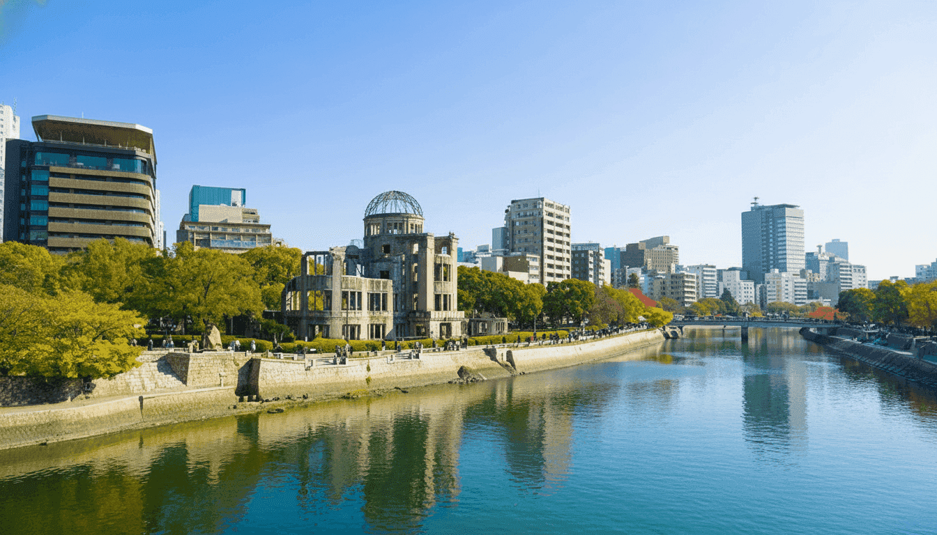 A-Bomb Dome and Hiroshima cityscape viewed from across the river on a clear sunny day, Japan