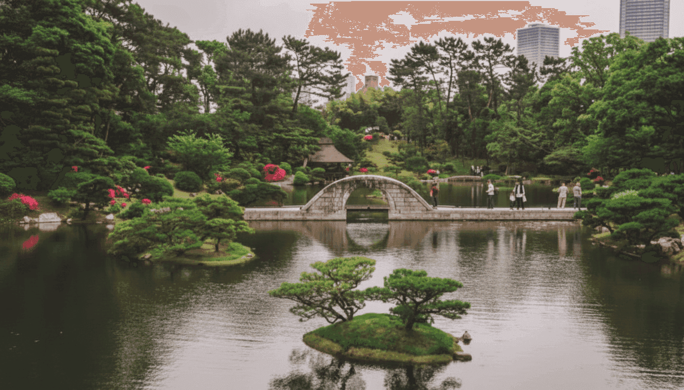 Shukkeien Garden stone arch bridge over the lake with small pine-covered island and overcast sky, Hiroshima Japan