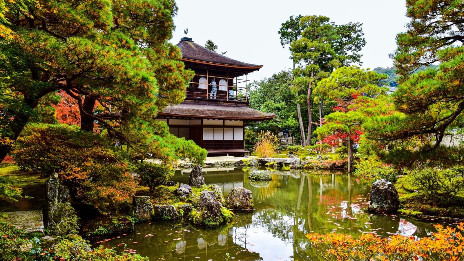 The Silver Pavilion of Ginkaku-ji behind its pond garden, with pines and early autumn color, Kyoto