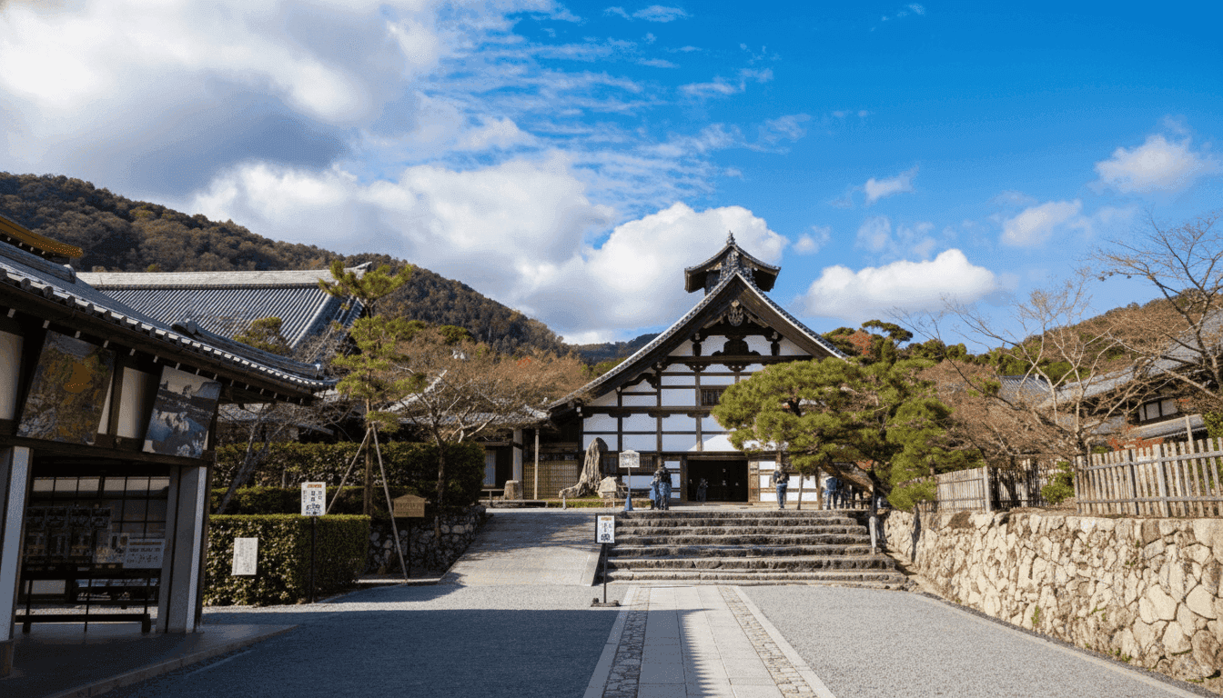 The stone-paved approach and steps leading to Tenryu-ji's Kuri, with its white half-timbered gable