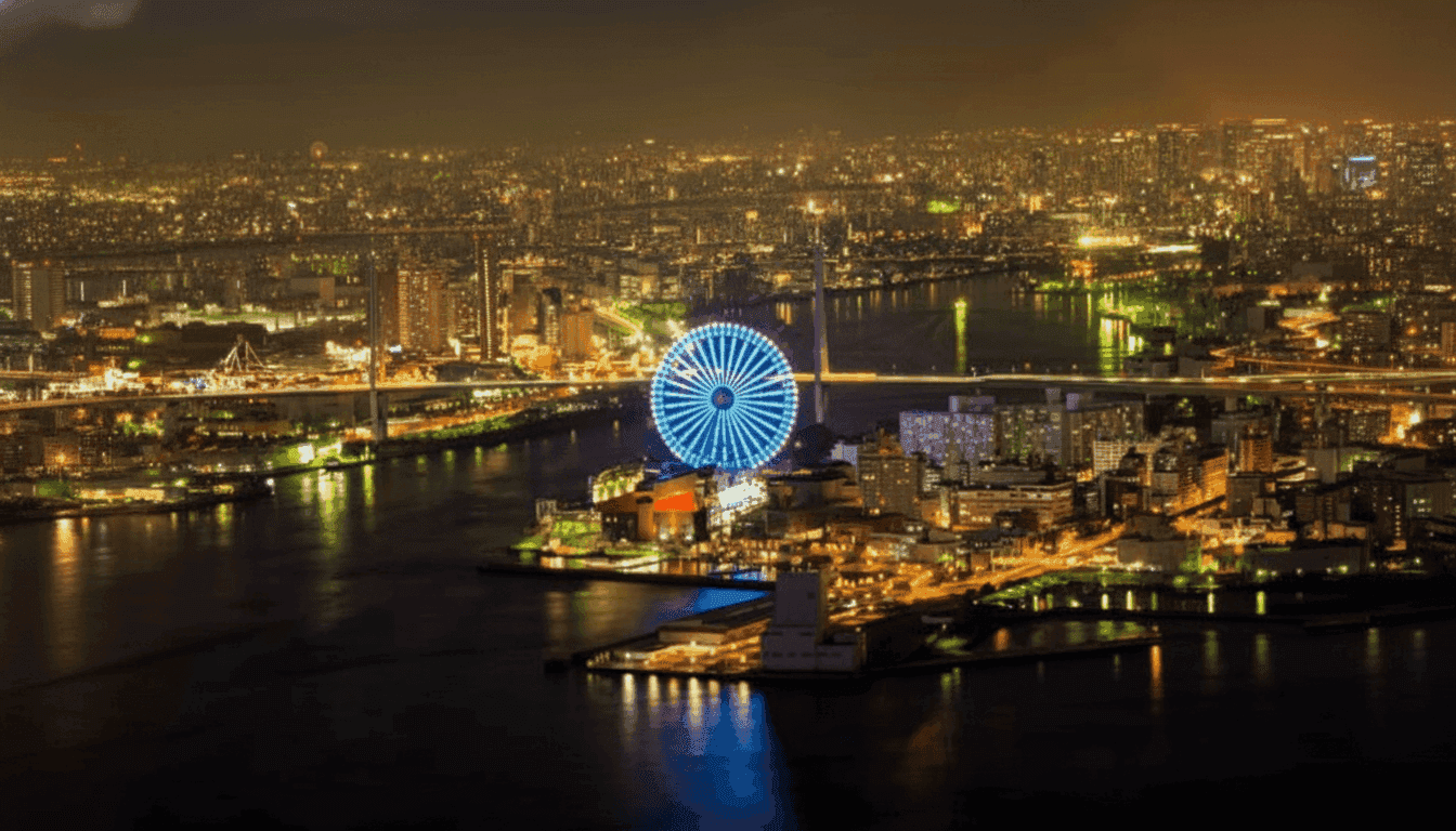 Tempozan Harbor Village waterfront with Osaka Bay ferris wheel illuminated at dusk and shopping complex below, Japan