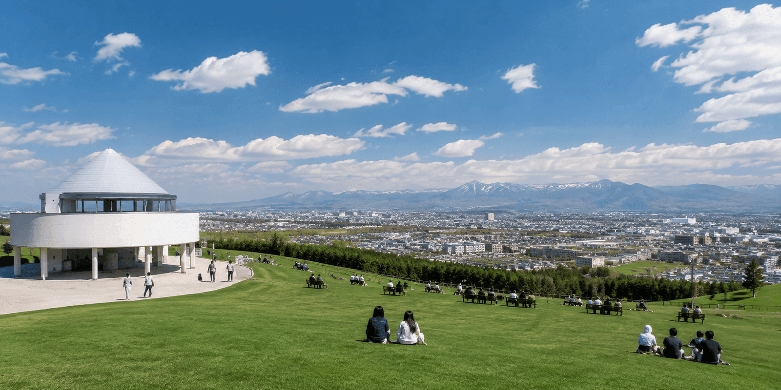 Bronze statue of Dr. Clark overlooking the pastoral hillside and sheep pasture at Hitsujigaoka Observation Hill Sapporo Japan