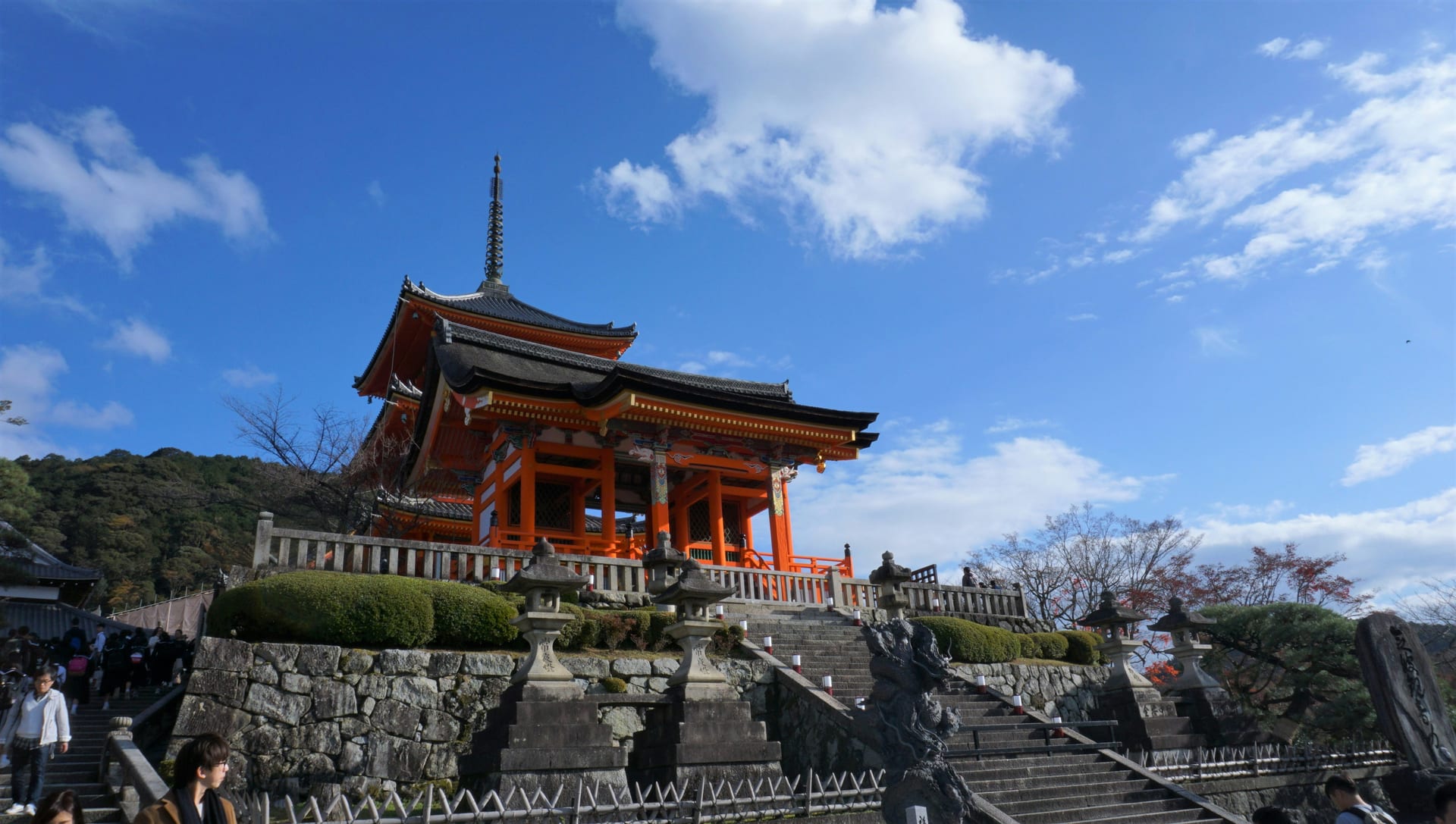 A vermilion gate and the three-story pagoda at the top of Kiyomizu-dera's stone entrance steps